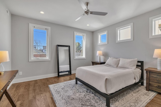 bedroom featuring hardwood / wood-style floors and ceiling fan