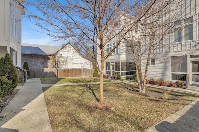 view of yard with a sunroom