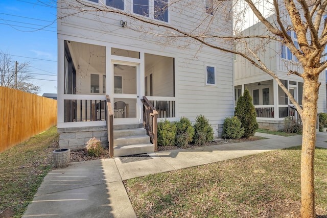 view of front of home featuring a sunroom