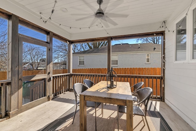 sunroom / solarium with ceiling fan