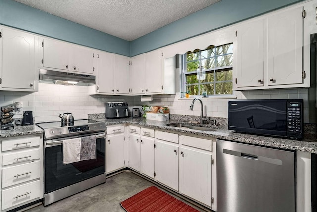 kitchen with light stone countertops, a textured ceiling, stainless steel appliances, white cabinets, and sink