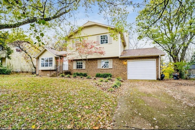 view of front of home featuring a front lawn and a garage