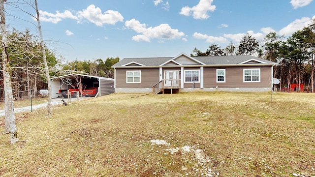 view of front of house with a carport and a front lawn