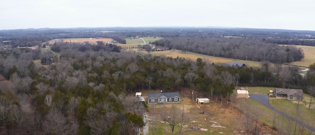 birds eye view of property with a rural view