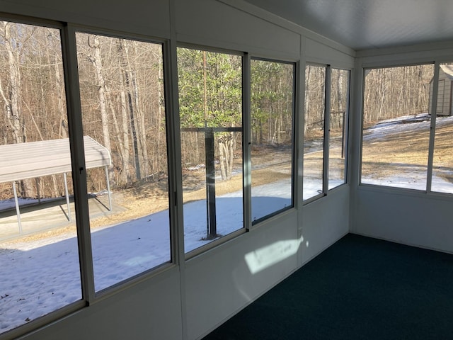 unfurnished sunroom with vaulted ceiling