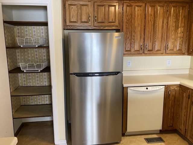 kitchen with stainless steel refrigerator and dishwasher