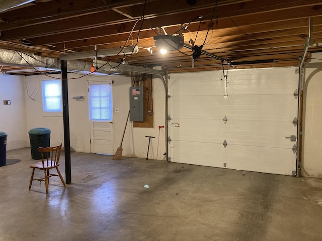 garage with electric panel and a garage door opener