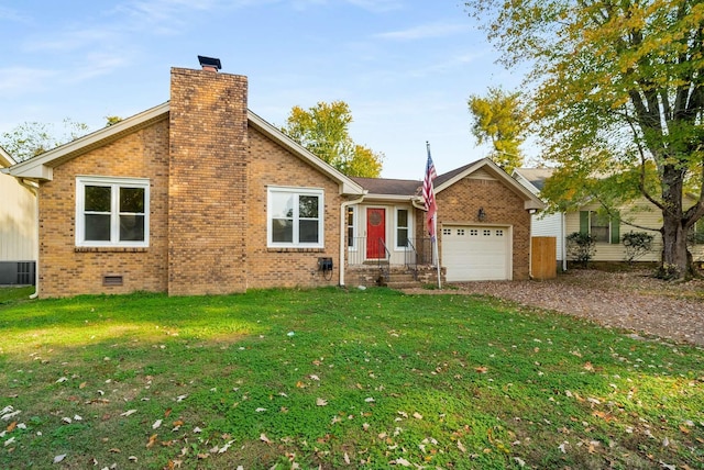 view of front of house with a front yard and a garage