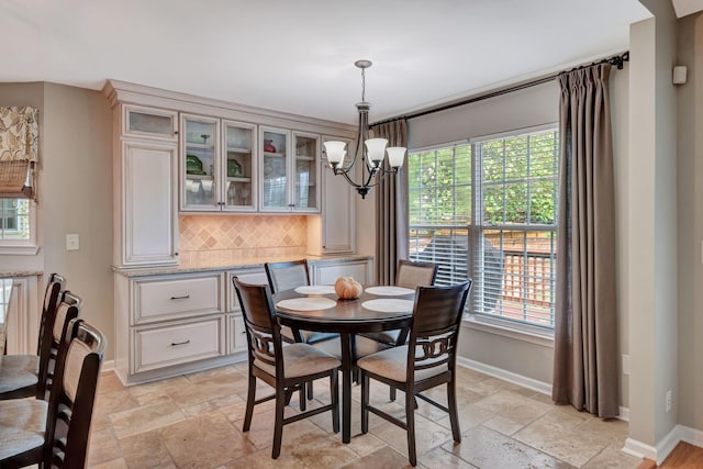 dining room with a notable chandelier