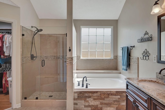 bathroom with vanity and plus walk in shower