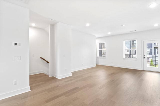 unfurnished room with light wood-type flooring