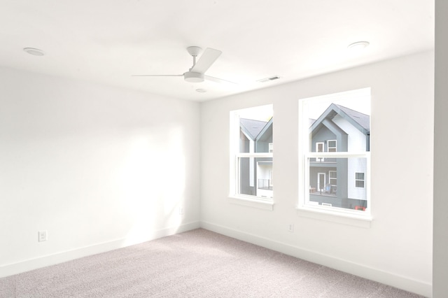 carpeted empty room with ceiling fan