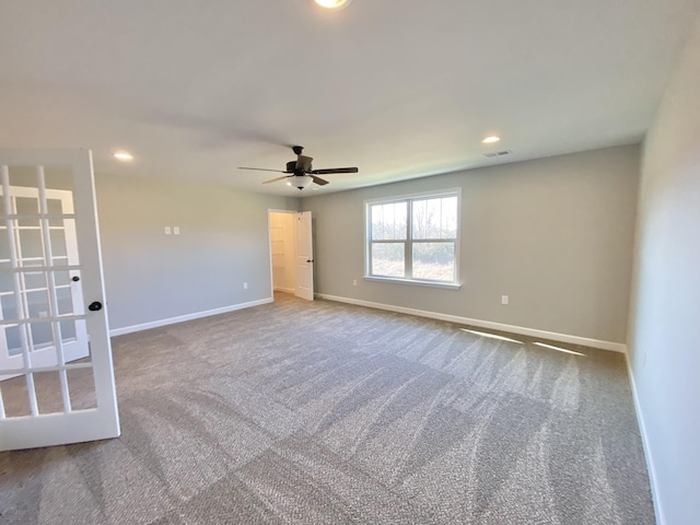 unfurnished room featuring carpet floors and ceiling fan