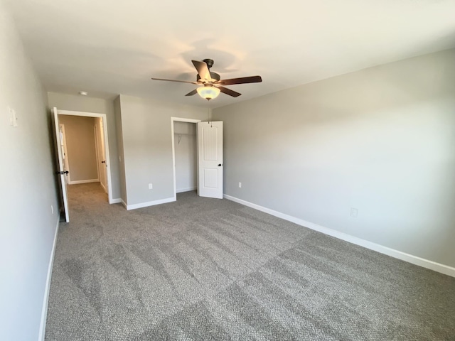 unfurnished bedroom featuring carpet floors, ceiling fan, and a closet