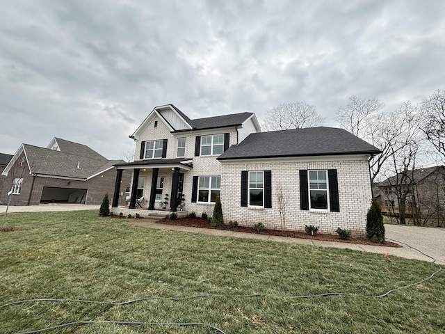 view of front of home featuring a porch and a front lawn