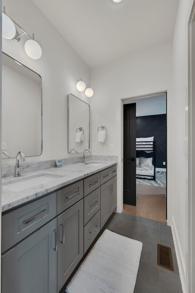 bathroom with vanity and tile patterned flooring