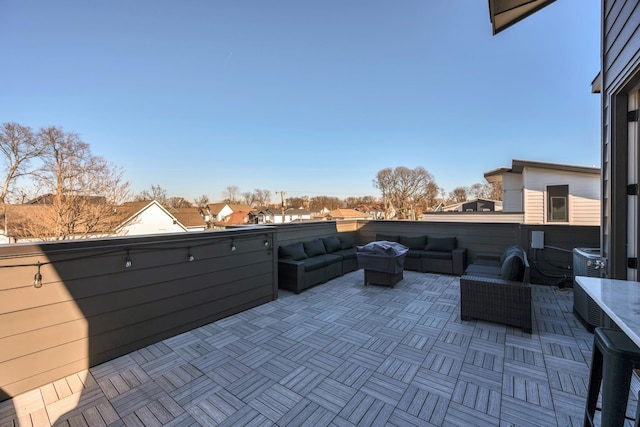 view of patio / terrace featuring a balcony, central air condition unit, and outdoor lounge area