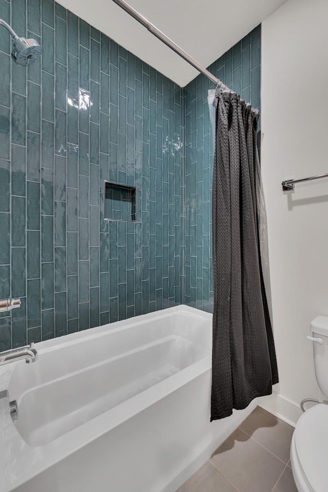 bathroom featuring toilet, tile patterned flooring, and shower / bathtub combination with curtain