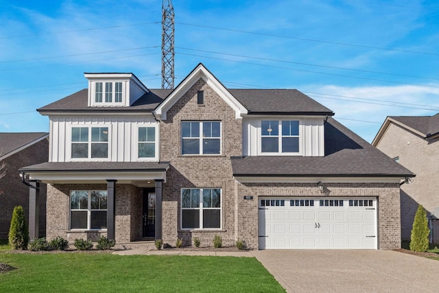 view of front of home with a front lawn and a garage