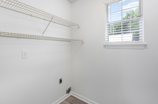 washroom with hookup for an electric dryer and hardwood / wood-style floors