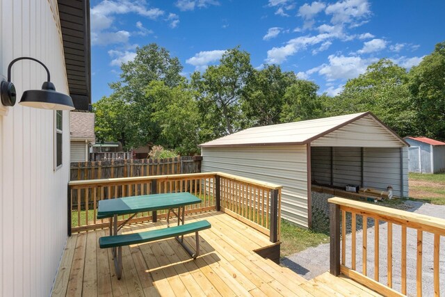 wooden terrace with a shed