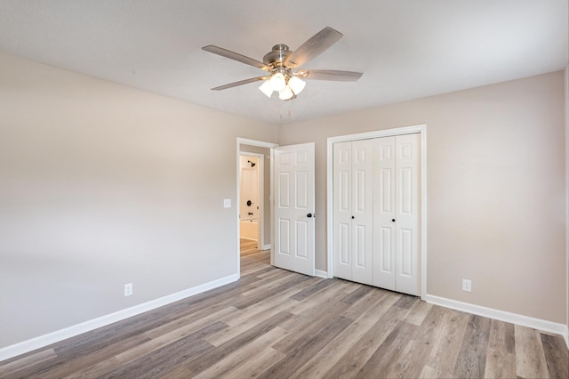 unfurnished bedroom with a closet, ceiling fan, and light hardwood / wood-style floors