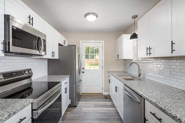 kitchen featuring white cabinetry and appliances with stainless steel finishes