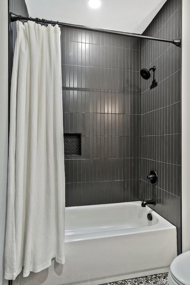 bathroom featuring shower / tub combo with curtain