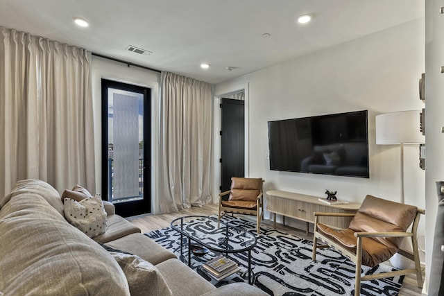 living room with light hardwood / wood-style floors