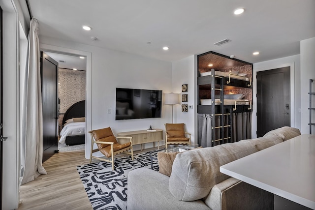 living room with light hardwood / wood-style flooring