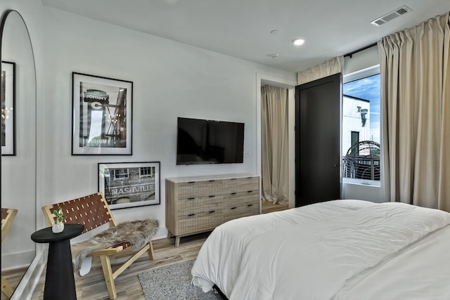 bedroom featuring wood-type flooring