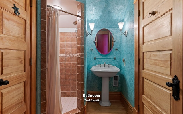 bathroom with a shower with curtain