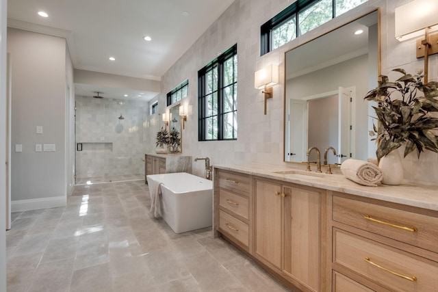 bathroom featuring vanity, tile walls, independent shower and bath, and crown molding