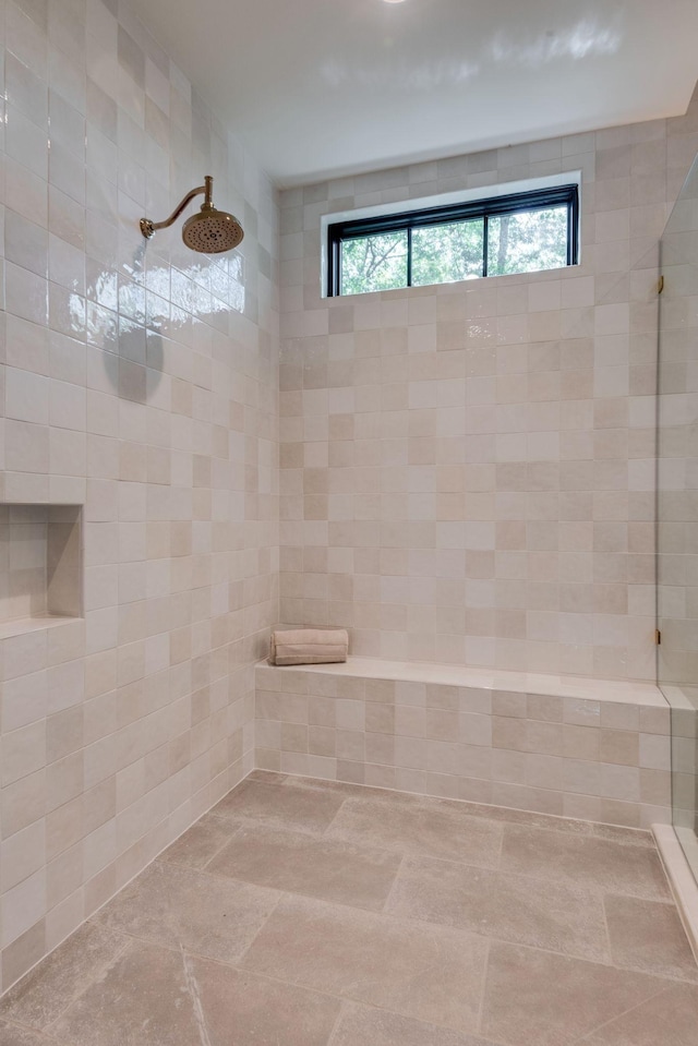 bathroom with tiled shower