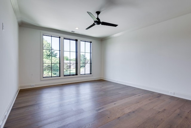 unfurnished room featuring hardwood / wood-style flooring, ceiling fan, and crown molding