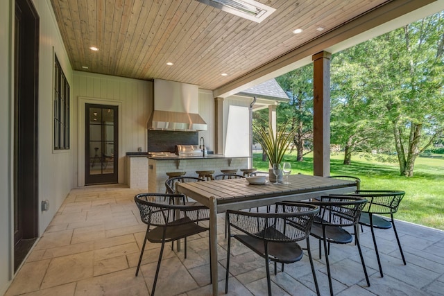 view of patio featuring an outdoor kitchen and sink