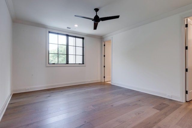 unfurnished room with ornamental molding, ceiling fan, and light wood-type flooring