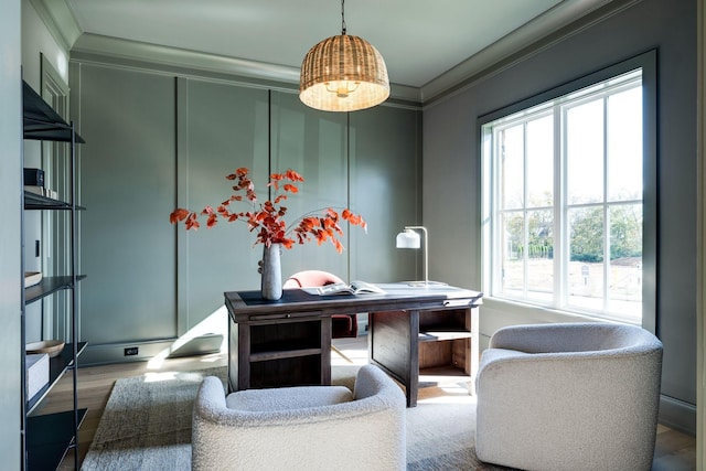 office area with wood-type flooring and crown molding