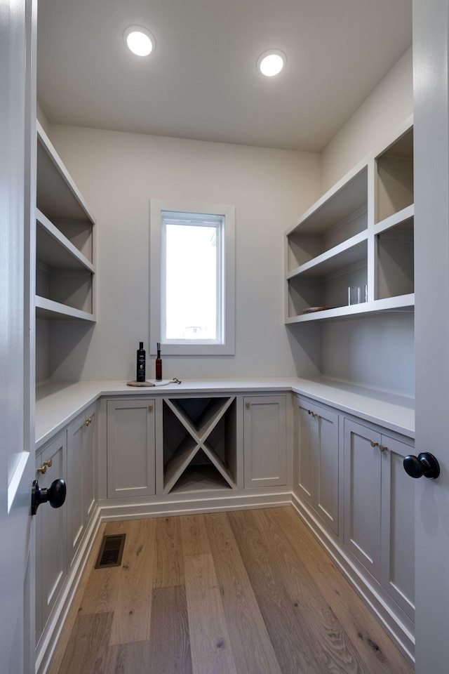 laundry area featuring light hardwood / wood-style floors