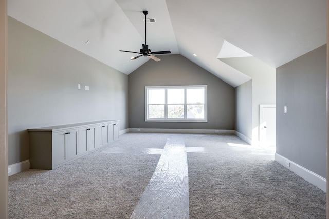 bonus room with ceiling fan, light colored carpet, and vaulted ceiling