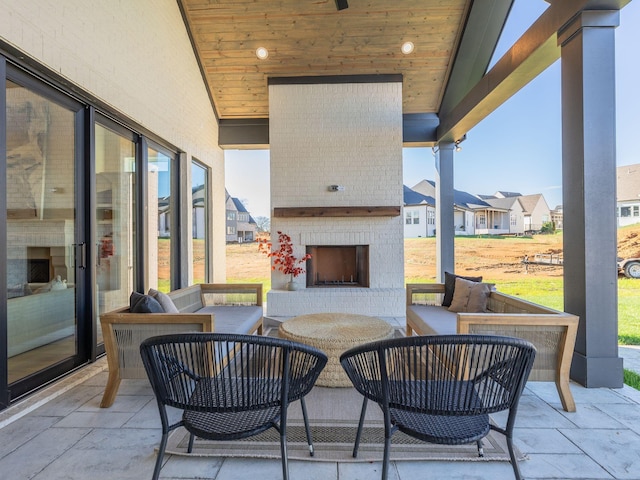 view of patio / terrace featuring an outdoor living space with a fireplace