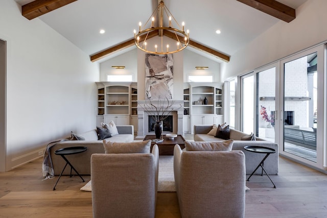 living room with high vaulted ceiling, beam ceiling, light hardwood / wood-style flooring, and a chandelier