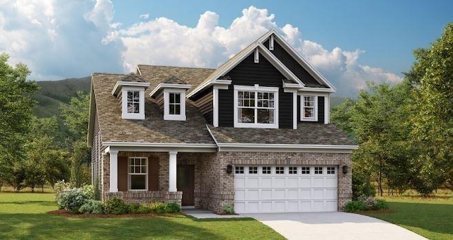 view of front of property featuring a front yard and a garage