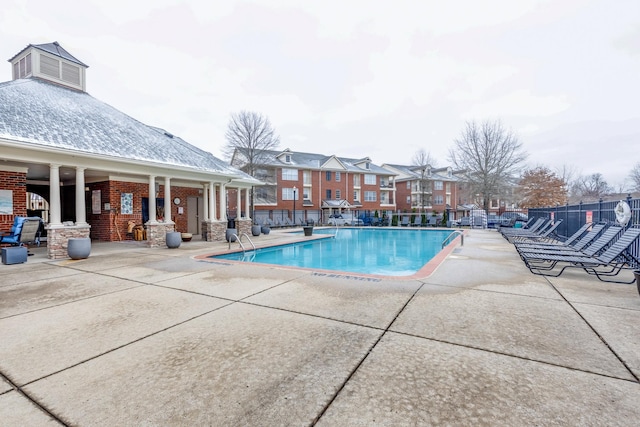 view of swimming pool with a patio area