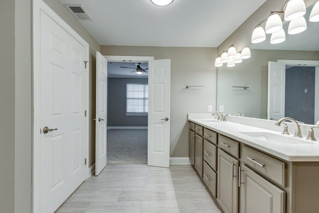 bathroom featuring ceiling fan and vanity