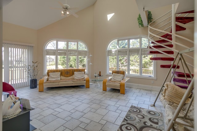 interior space featuring lofted ceiling and ceiling fan