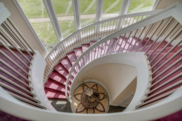 stairway featuring plenty of natural light