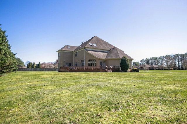 back of house with a yard