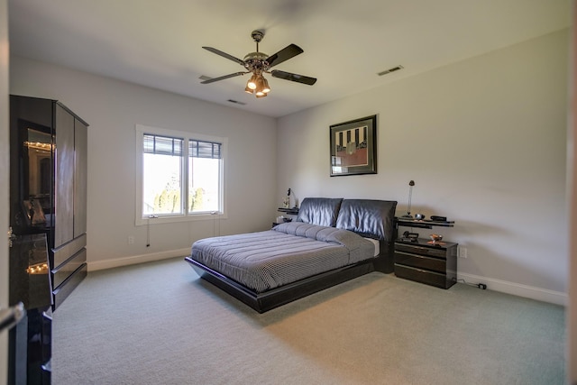 bedroom with ceiling fan and carpet