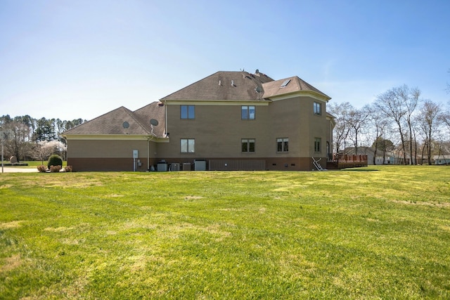 rear view of house with a lawn